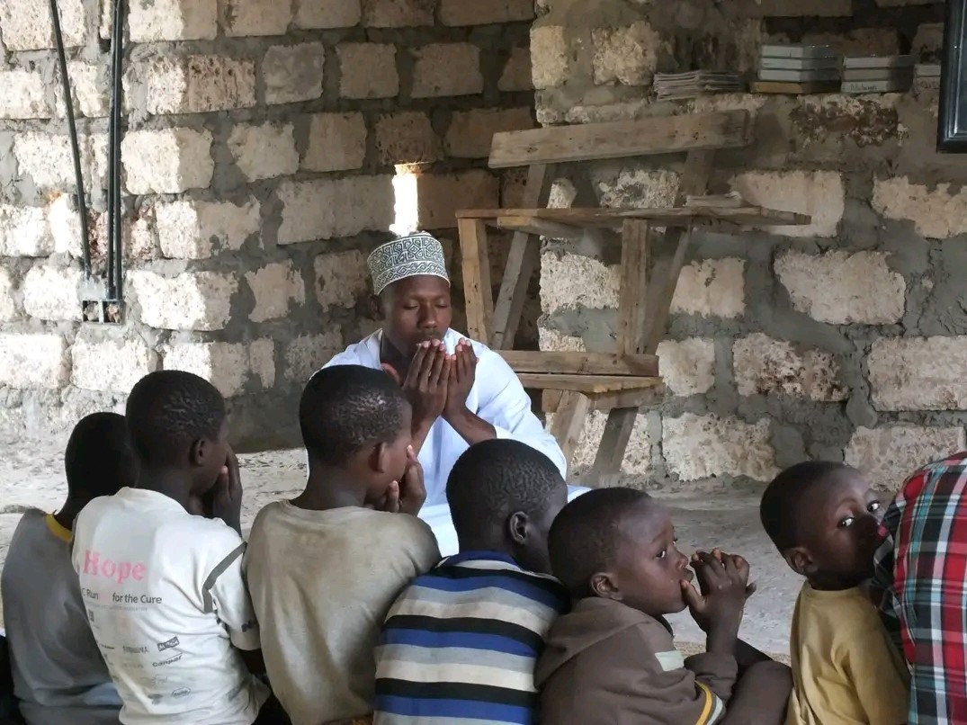 A teacher and children learning together